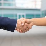 Closeup shot of business handshake. Closeup shot of business handshake. Cropped shot of two people wearing formal suits shaking hands. Business handshake concept